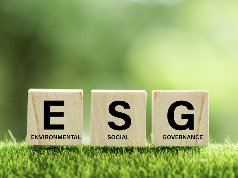 words ESG on a wood block and Future environmental conservation and sustainable ESG modernization development by using the technology of renewable resources to reduce pollution and carbon emission.